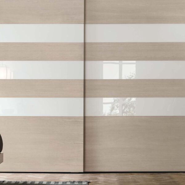 “Step 3 Sliding wardrobe by Tomasella – modern Italian wardrobe with recessed handle detail and clean-lined sliding doors”