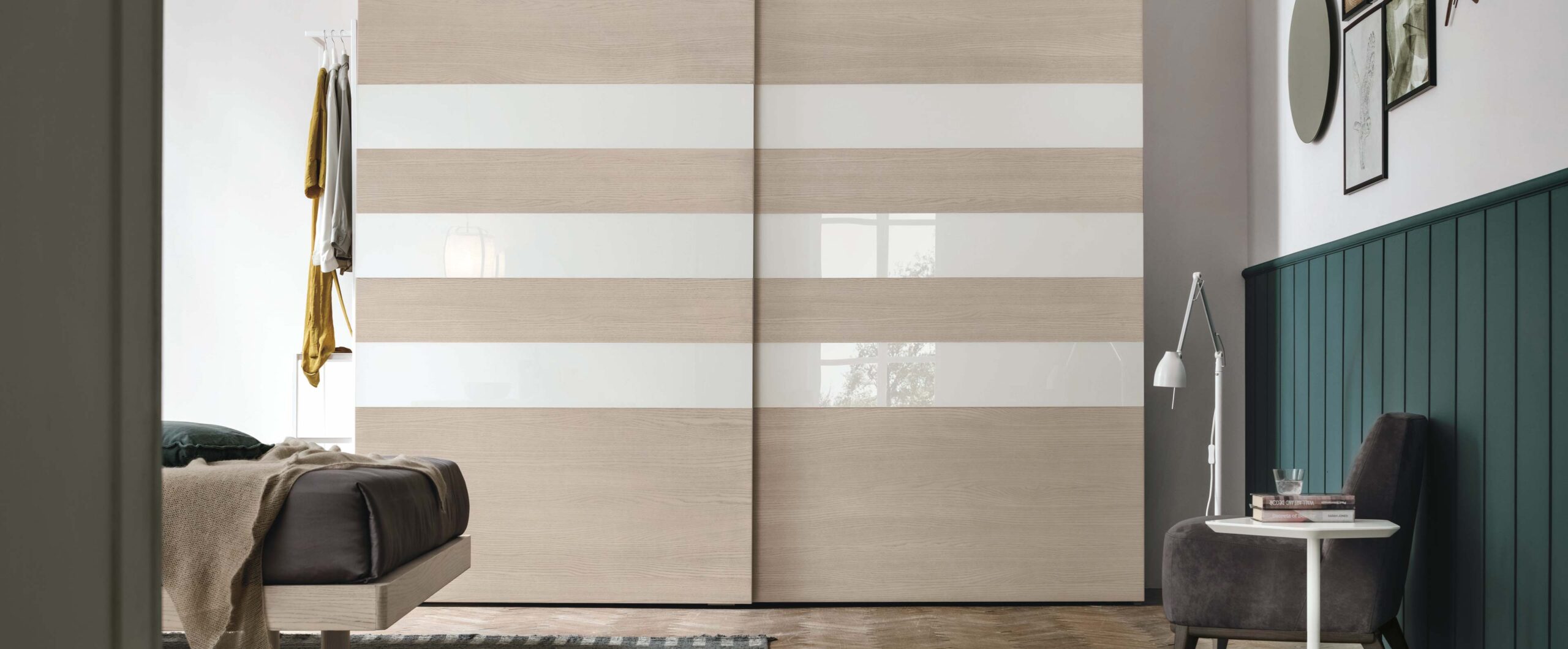 “Step 3 Sliding wardrobe by Tomasella – modern Italian wardrobe with recessed handle detail and clean-lined sliding doors”