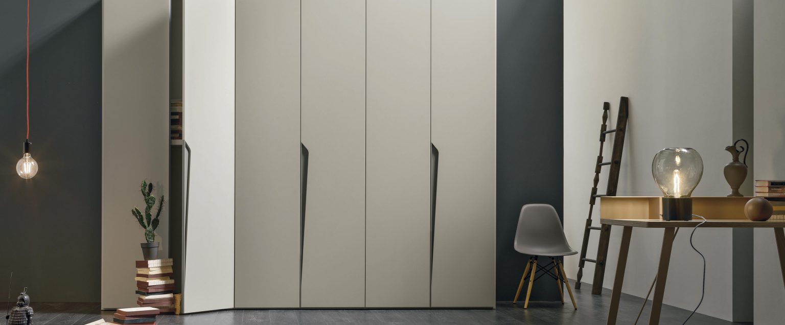 “Drop wardrobe by Tomasella – modern Italian wardrobe with integrated curved handle design and sleek vertical panels”