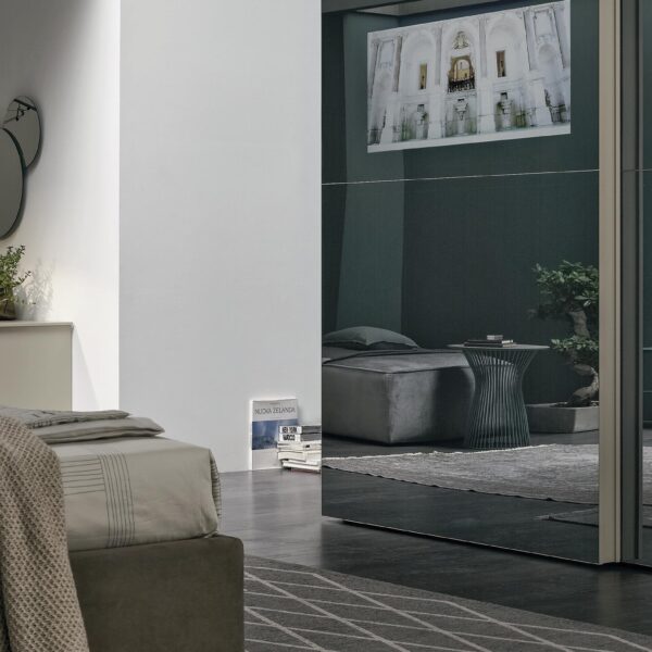 “Vision Sliding wardrobe by Tomasella – modern Italian wardrobe with sculpted 3D-effect doors and sleek sliding panels”