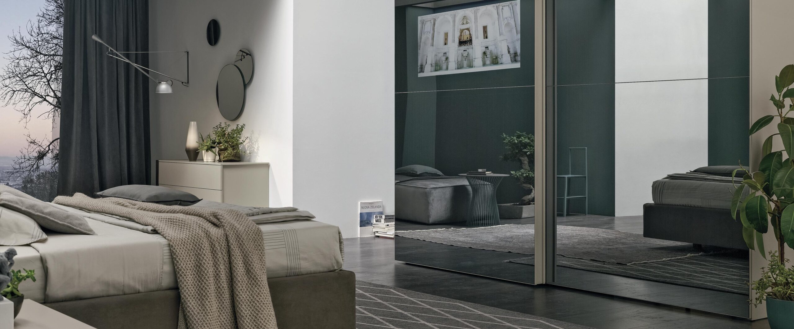 “Vision Sliding wardrobe by Tomasella – modern Italian wardrobe with sculpted 3D-effect doors and sleek sliding panels”