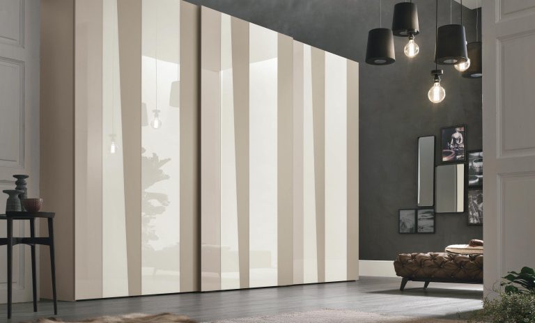 “Kelly Sliding wardrobe by Tomasella – modern Italian wardrobe with sleek sliding doors, geometric panel design, and minimalist styling”