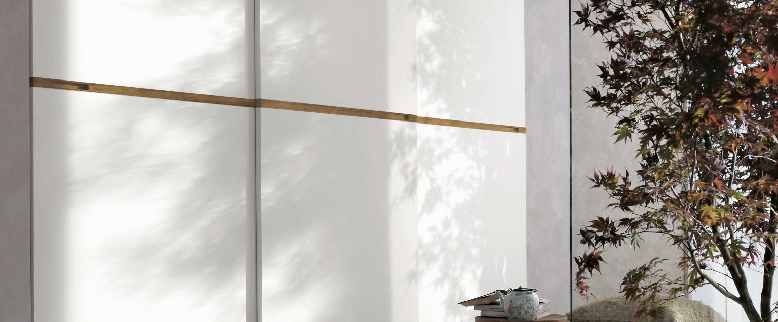 "Tomasella Meridiana Sliding – contemporary wardrobe featuring linear textured panels, handleless design, and minimalist styling"