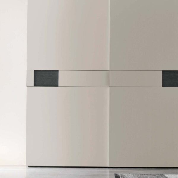 “Pitti Sliding wardrobe by Tomasella – modern Italian wardrobe with sculpted 3D-effect sliding doors and sleek profile”