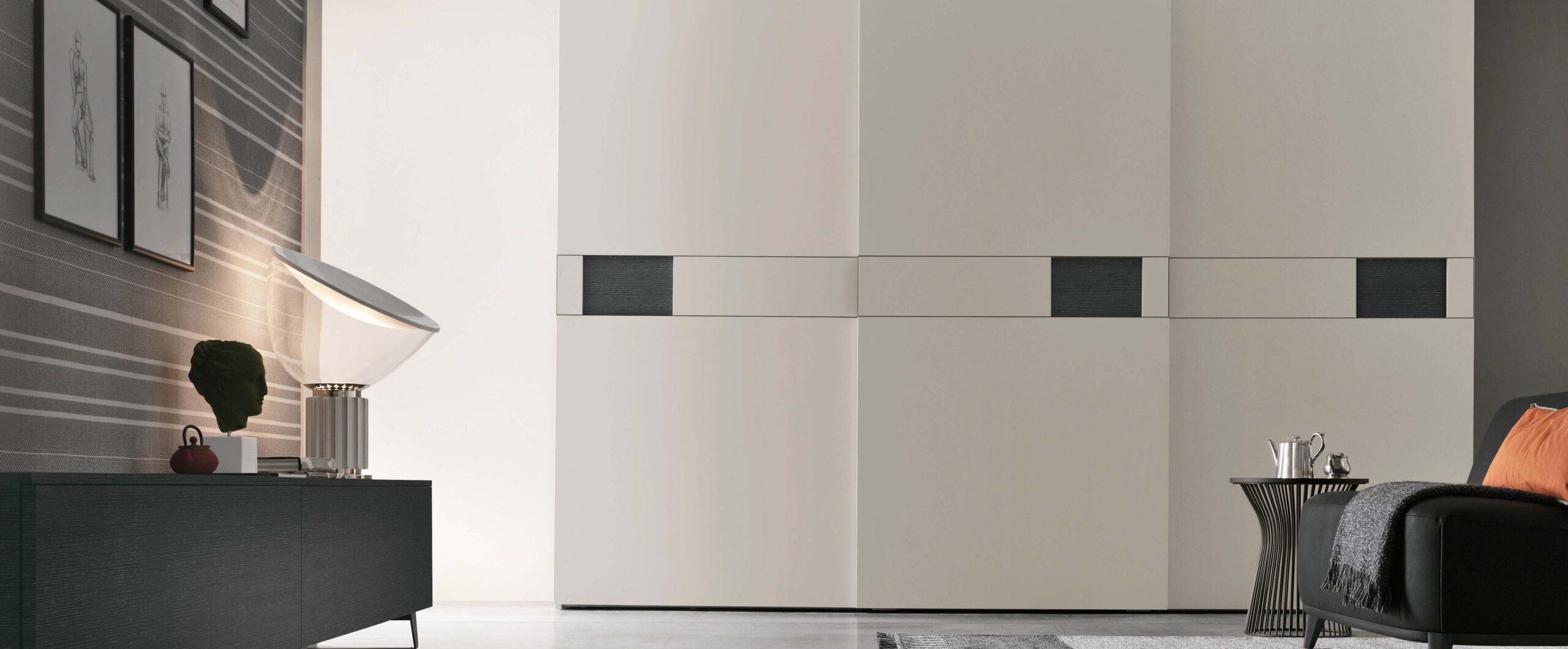 “Pitti Sliding wardrobe by Tomasella – modern Italian wardrobe with sculpted 3D-effect sliding doors and sleek profile”