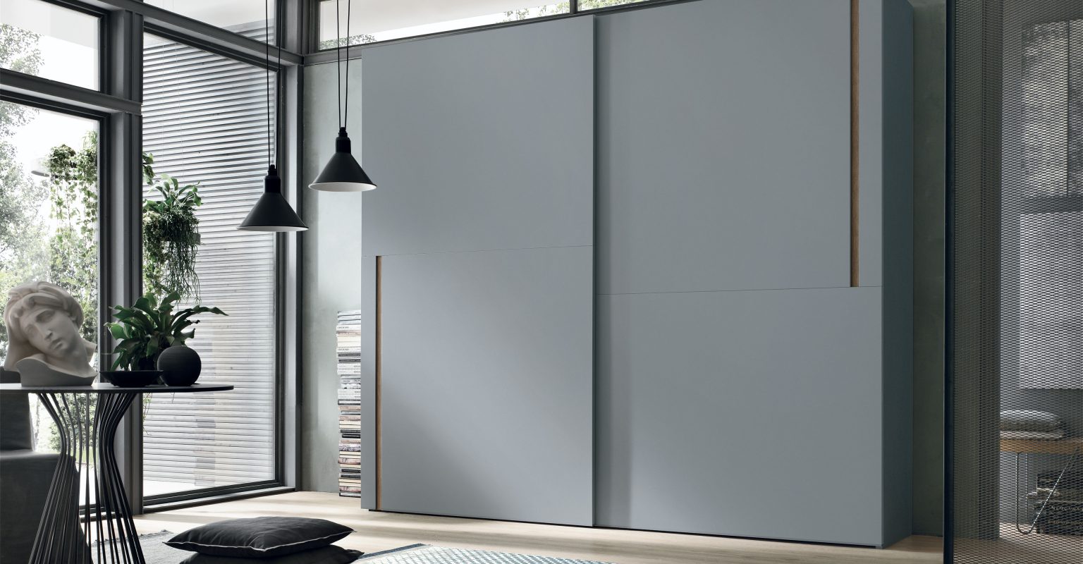 “Denver Sliding wardrobe by Tomasella – modern Italian wardrobe with sleek sliding doors and vertical groove detailing”