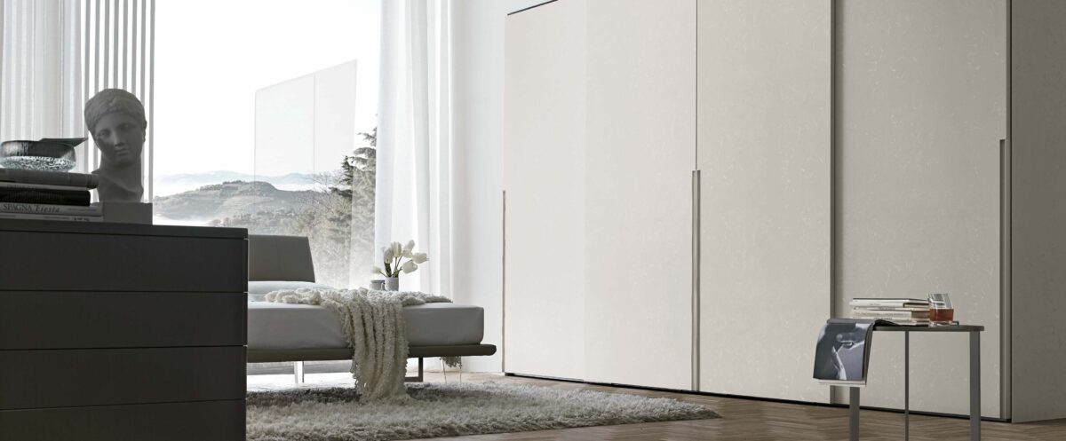“Doris Sliding wardrobe by Tomasella – modern Italian wardrobe with smooth sliding doors and integrated recessed handles”
