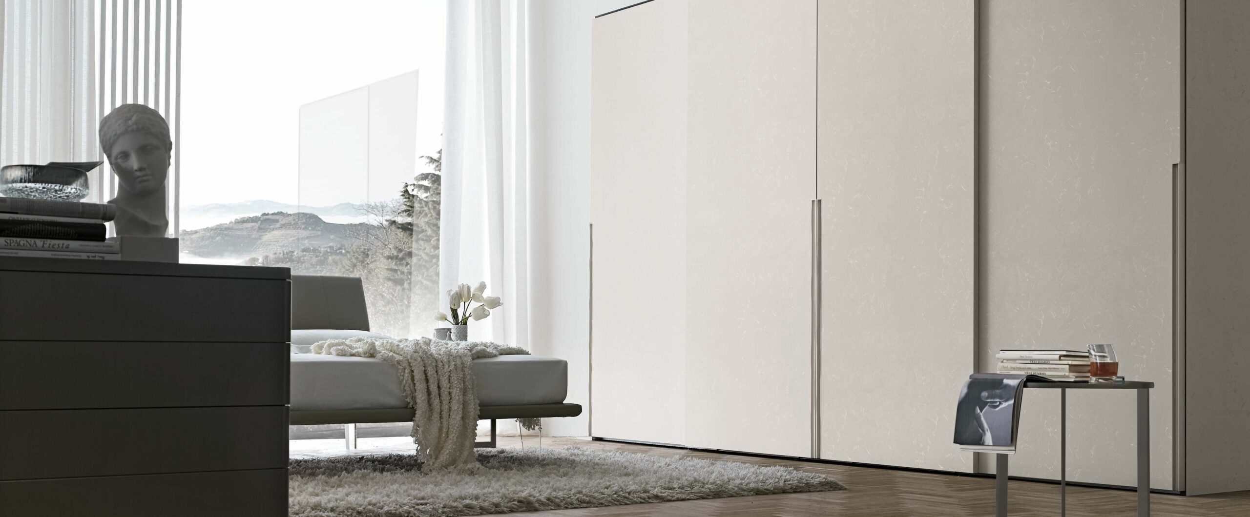 “Doris Sliding wardrobe by Tomasella – modern Italian wardrobe with smooth sliding doors and integrated recessed handles”