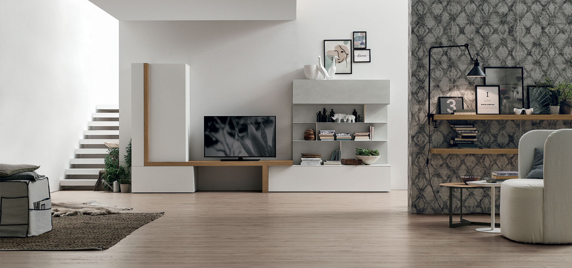 “Atlante UNIT_AT127 by Tomasella – modern Italian wall unit with suspended TV base and vertical open shelving design”