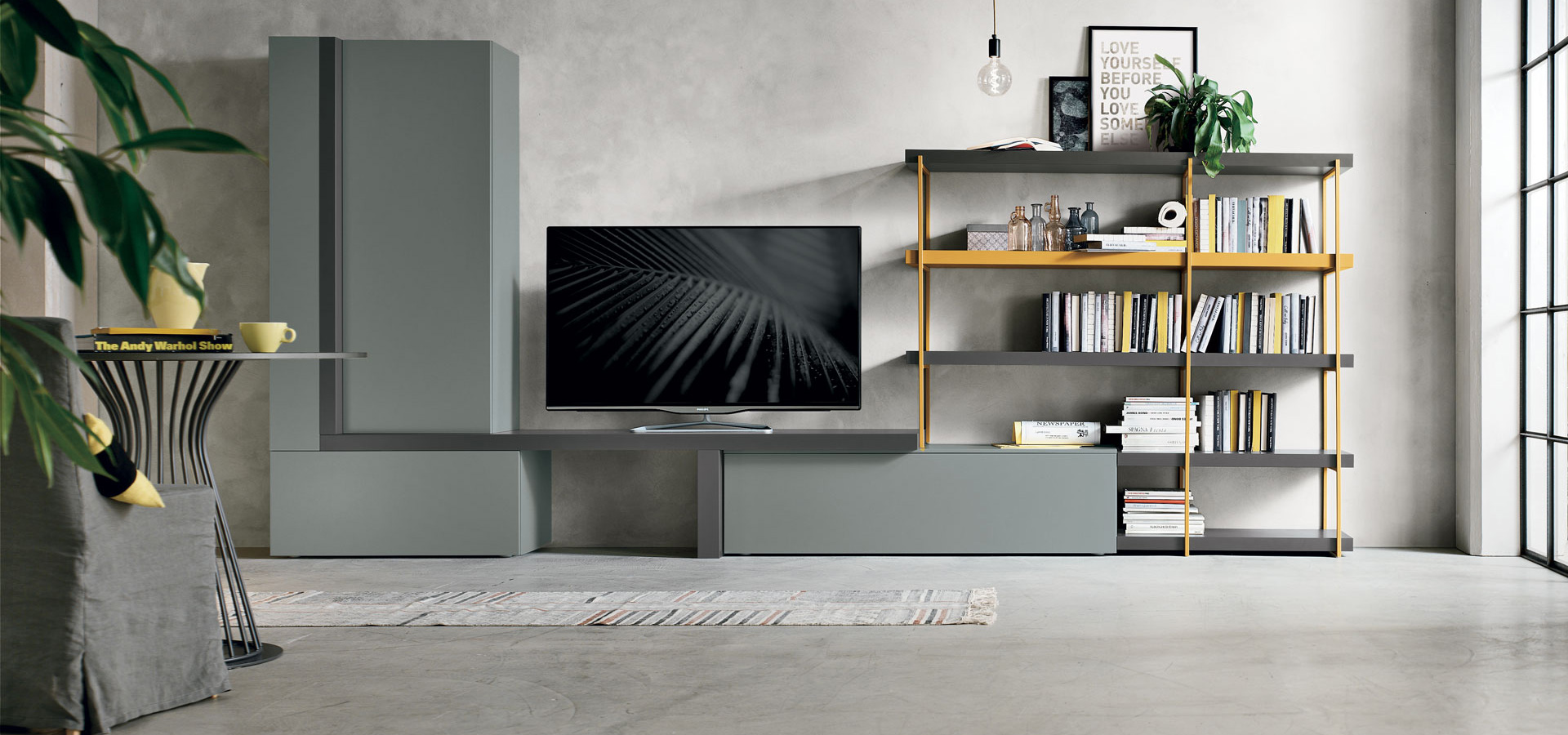 “Atlante UNIT_AT136 by Tomasella – modern Italian wall unit with low-profile TV base, vertical open shelving, and sleek matte finish”