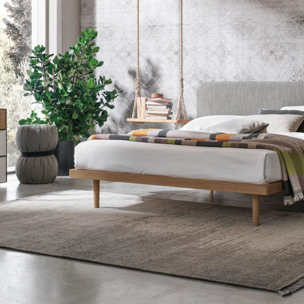 “Milly bed by Tomasella – modern Italian bed with curved upholstered headboard and slim minimalist frame”