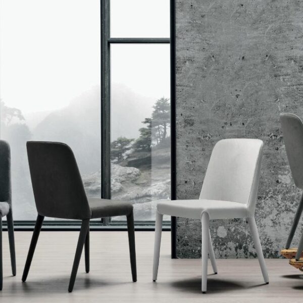 “Betty chair by Tomasella – modern Italian dining chair with curved upholstered back and sleek metal legs”