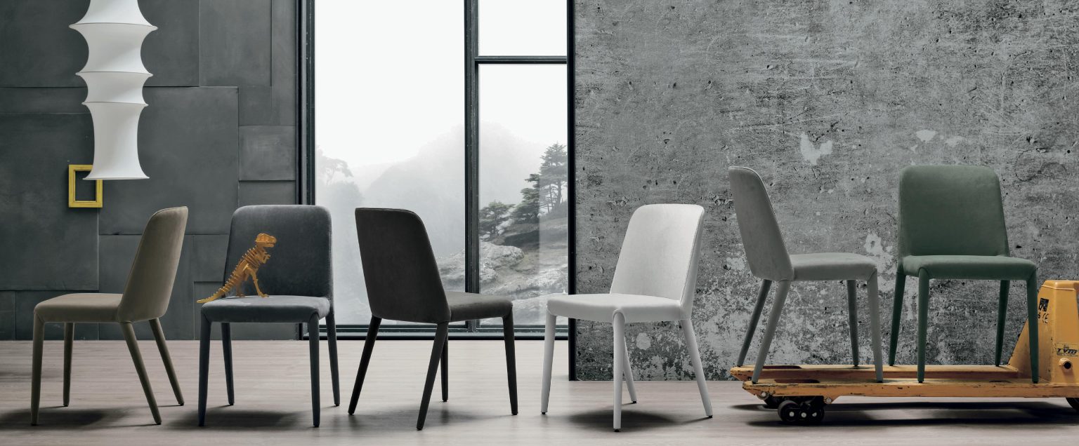 “Betty chair by Tomasella – modern Italian dining chair with curved upholstered back and sleek metal legs”