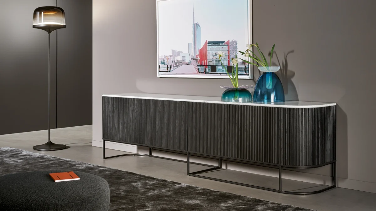 Dune TV Stand Light by Bonaldo with integrated LED lighting behind wavy doors and floating metal frame, warming the back panel