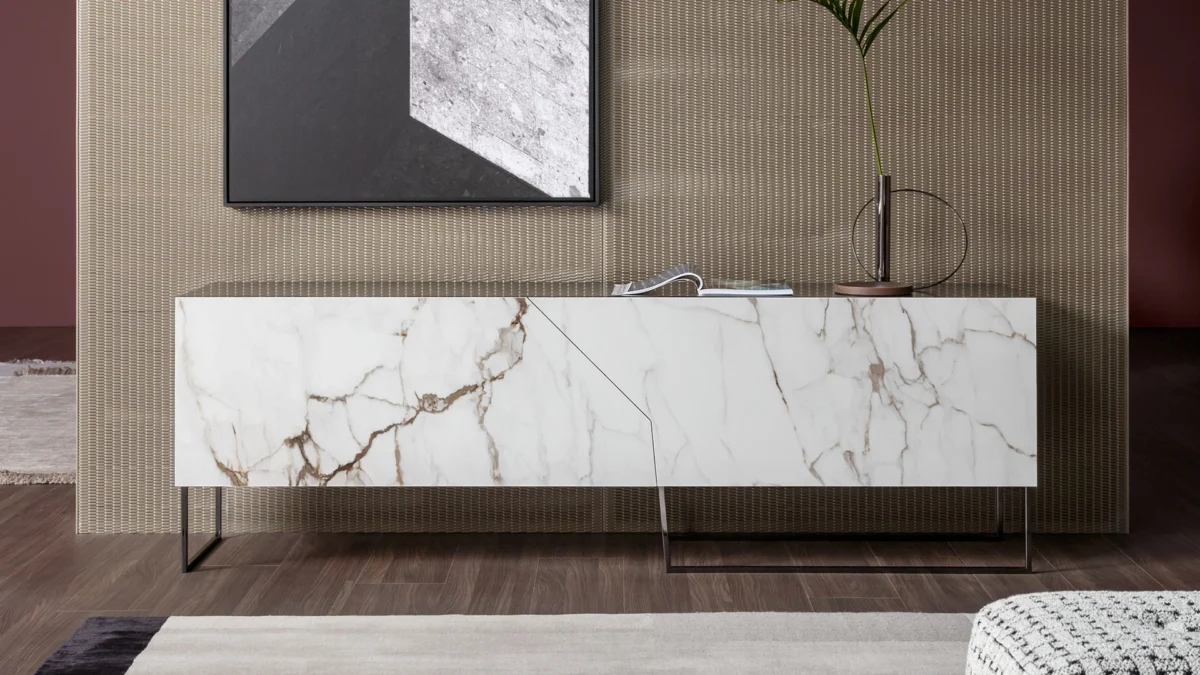 Contemporary Doppler K sideboard by Bonaldo combining irregular door geometry in silk-finish Rosso Imperiale ceramic with linear metal support.