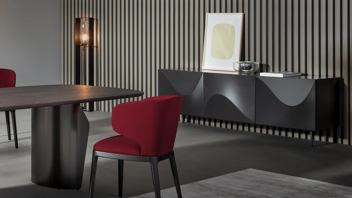 Vertigo sideboard by Bonaldo with soft wave-patterned doors in white lacquered polyurethane, white lacquered wood frame, and white metal base.