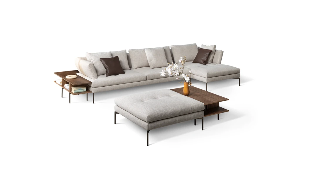 Alliances sideboard by Bonaldo with sculptural wood veneer front and slim metallic plinth base.