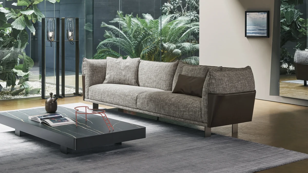 Blend sofa by Bonaldo with metal legs and a flowing, sculptural design in leather and fabric.