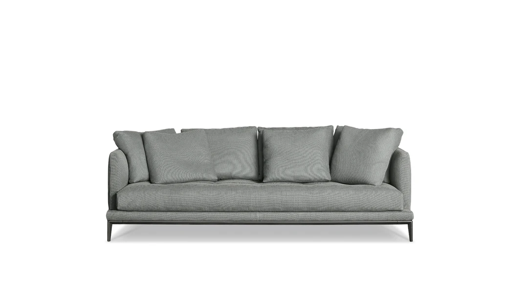Soft Island sofa by Bonaldo with deep seat, generous cushions, and slender metal base, designed by Sergio Bicego.