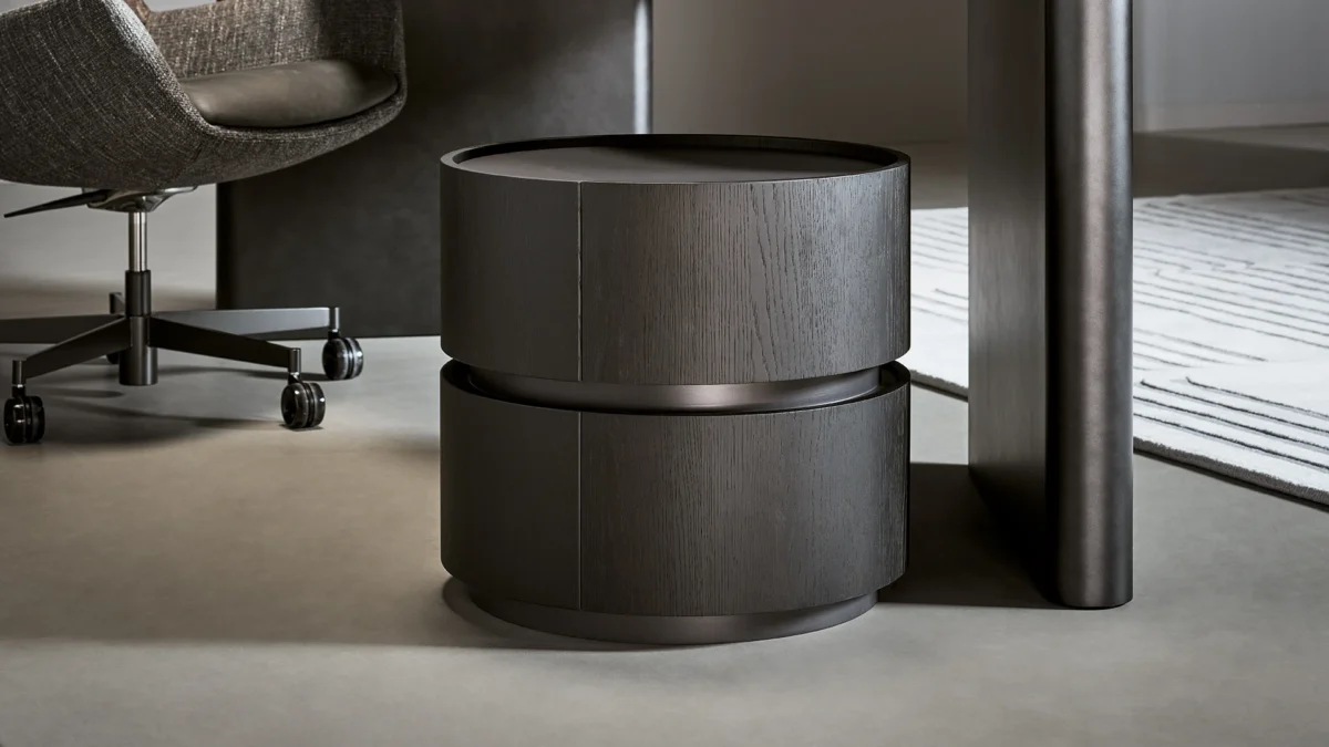 Contemporary Moneypenny bedside table by Bonaldo, presenting an elegant curved wooden cylinder with sliding drawers for efficient storage.