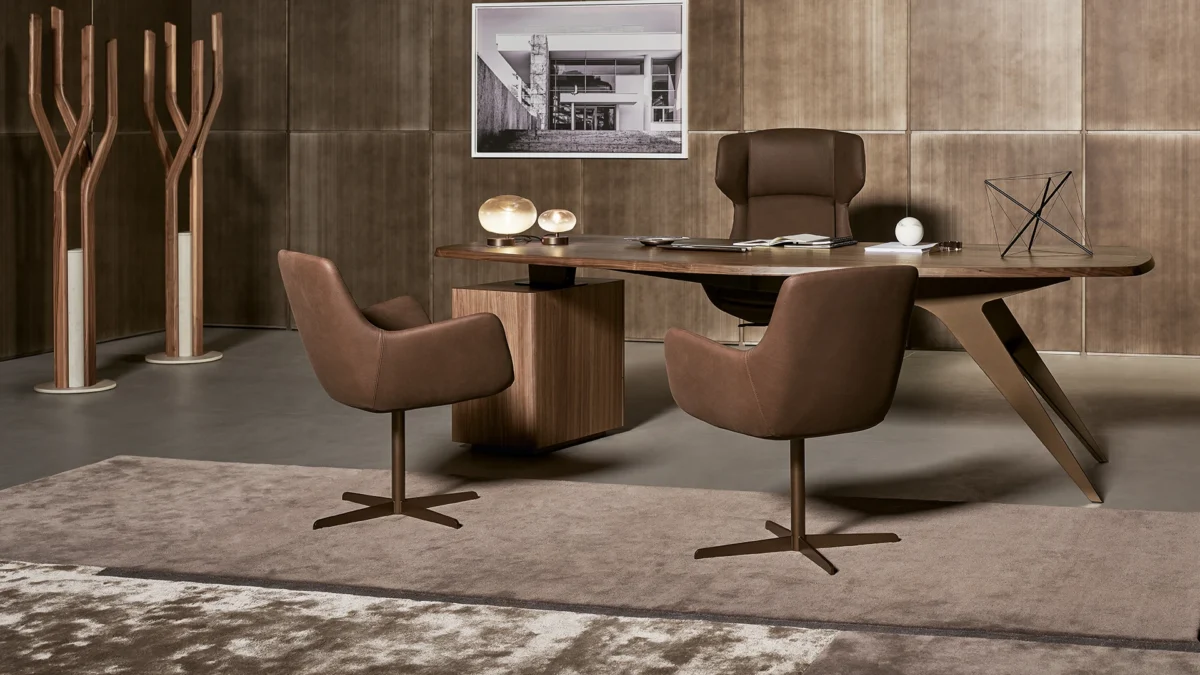 Newton executive chair by Bonaldo, featuring a high backrest and wide shell, upholstered in Procida leather, with a five-point swivel base.