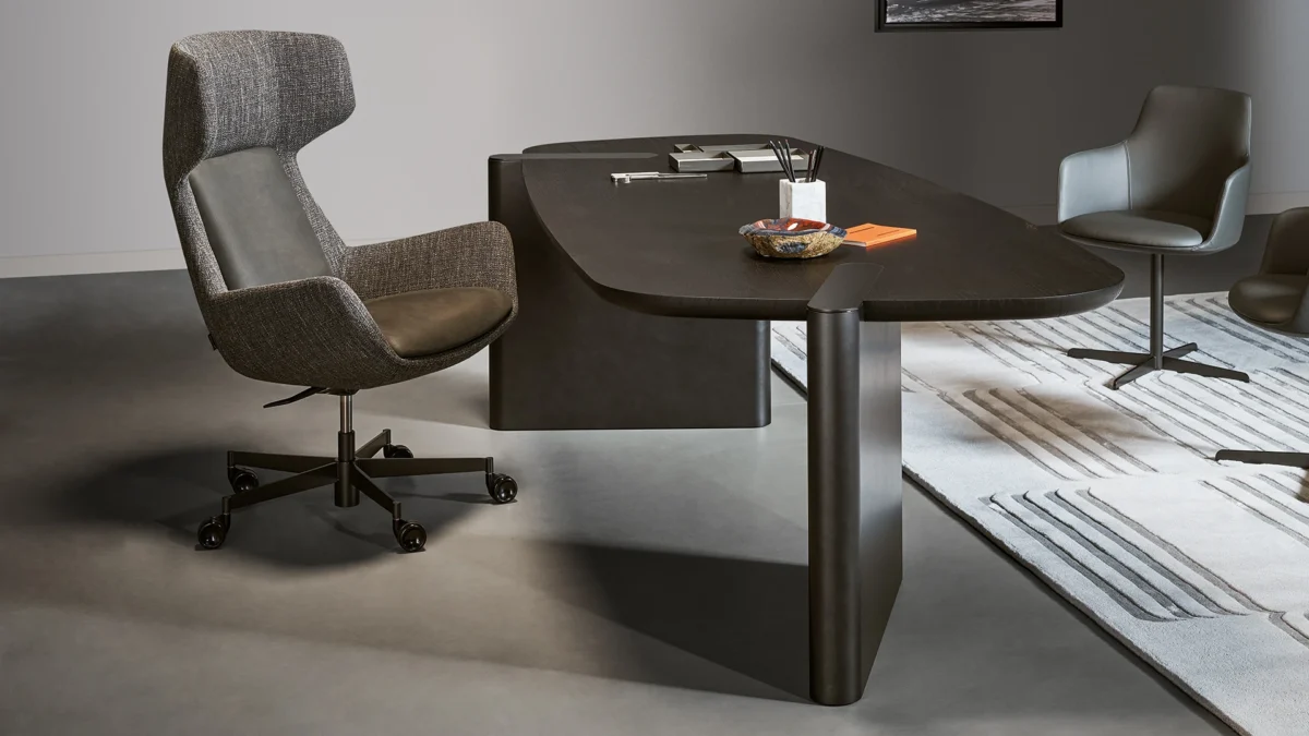 Bonaldo Newton Low armchair with a fixed base in bronze finish, upholstered in a mix of Ponza leather and Class fabric, perfect for guest seating.