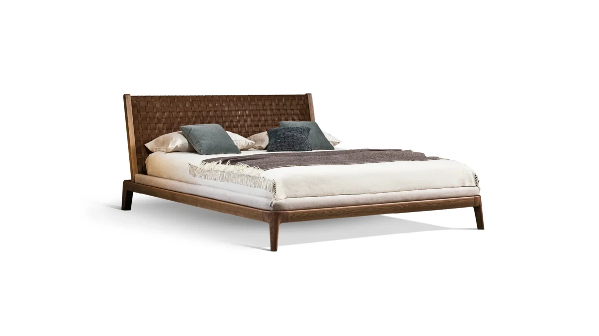 Bonaldo Honeymoon bed with solid American walnut frame and woven full‑grain leather headboard