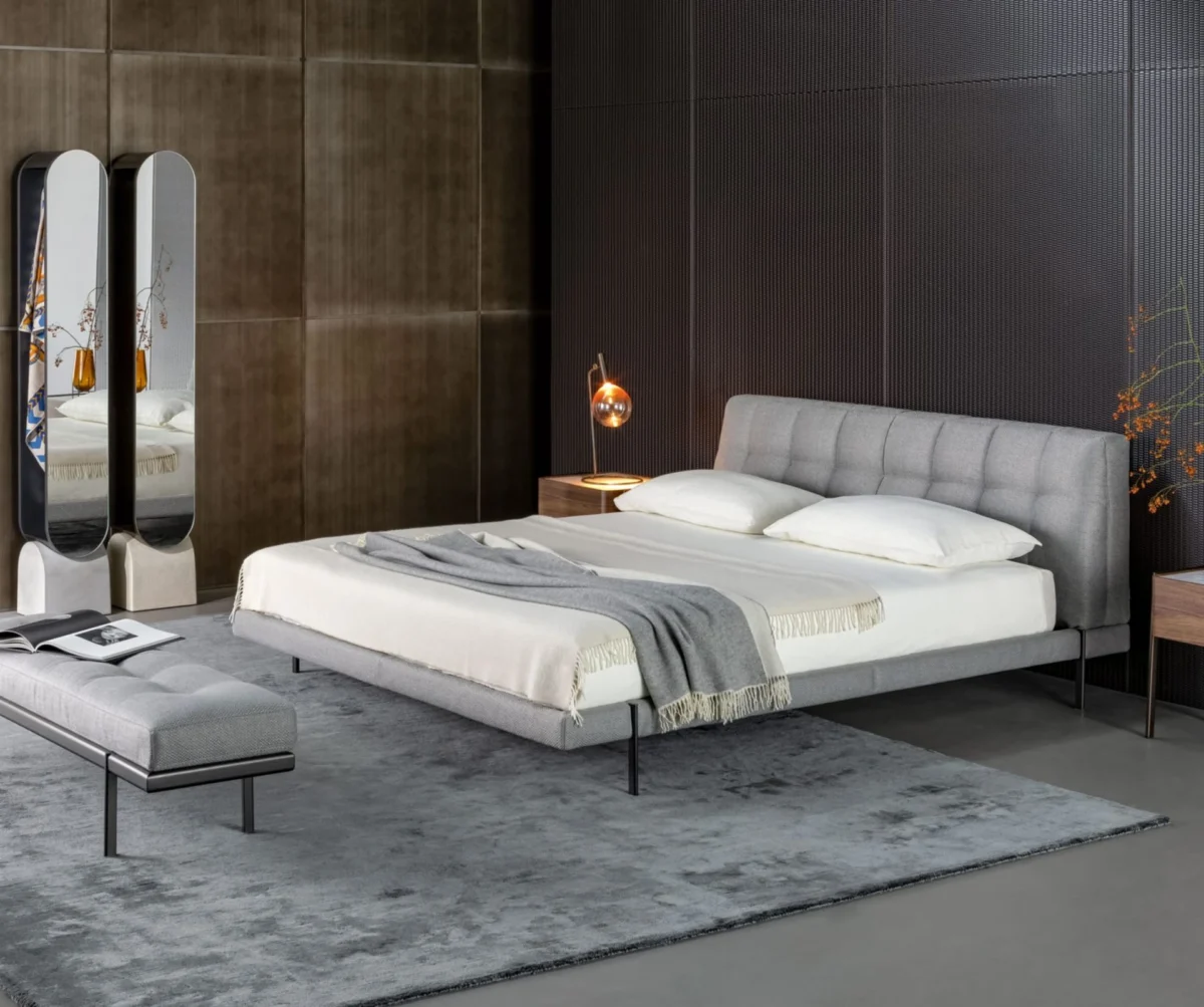 James Bench by Bonaldo, designed by Sergio Bicego, featuring a padded seat with sophisticated stitching and a sleek metal frame.