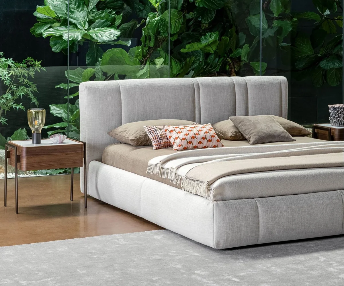 Bonaldo Rigoletto upholstered bed with geometric headboard and matte black metal legs, available in multiple sizes.