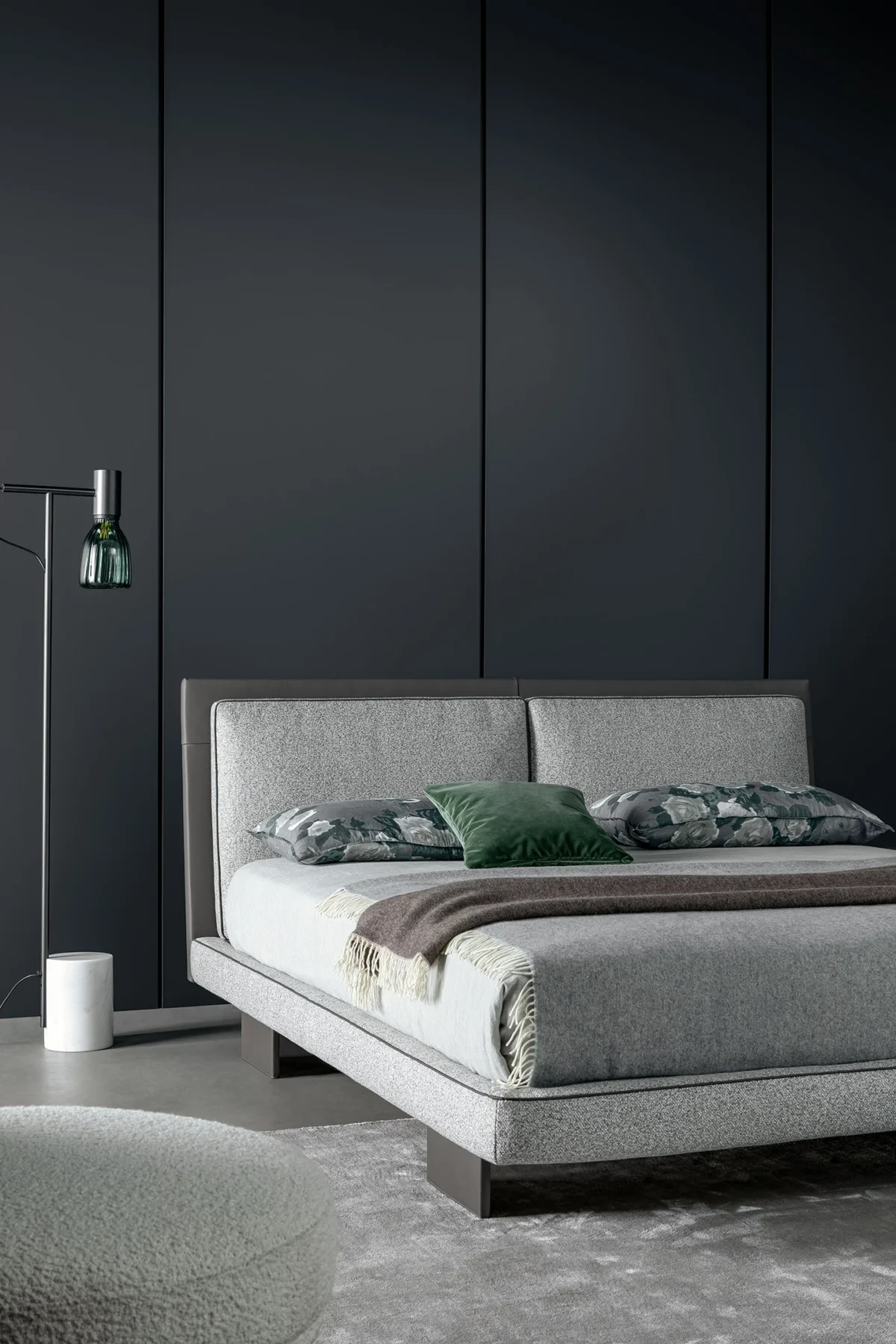 Contemporary Tara bed by Bonaldo featuring elegant piping, dual headboard cushions and slender leather-covered legs