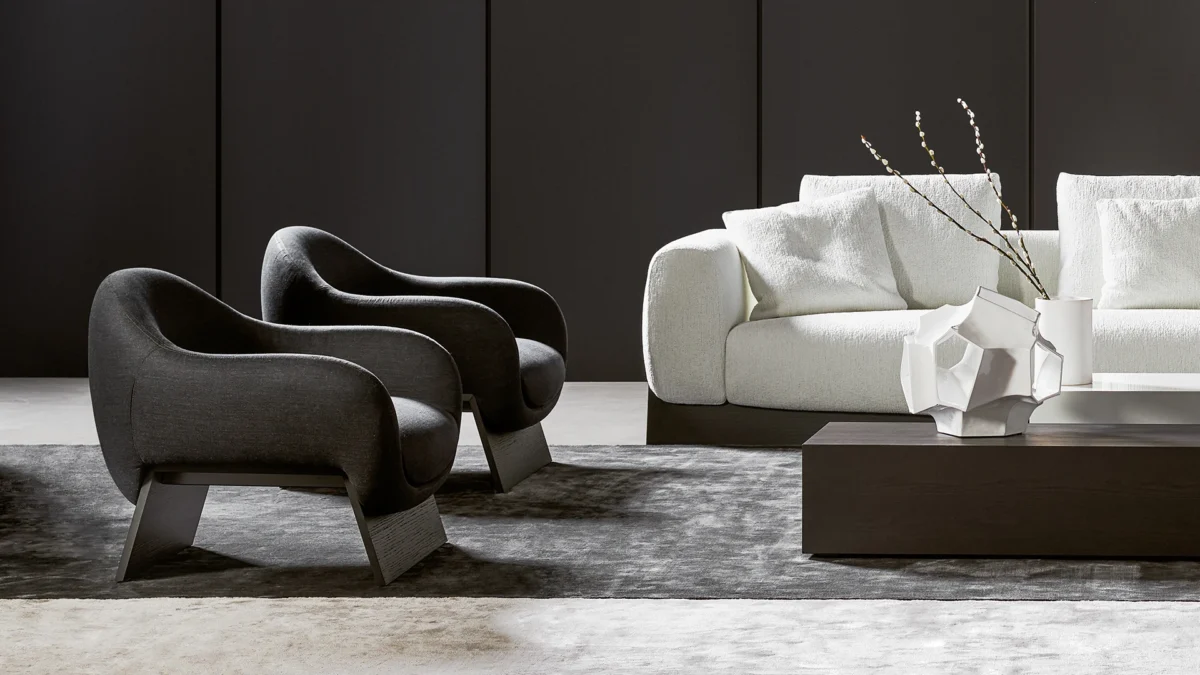 Elegant Boolean armchair designed by Giuseppe Viganò for Bonaldo, available in fabric or leather with walnut or oak base