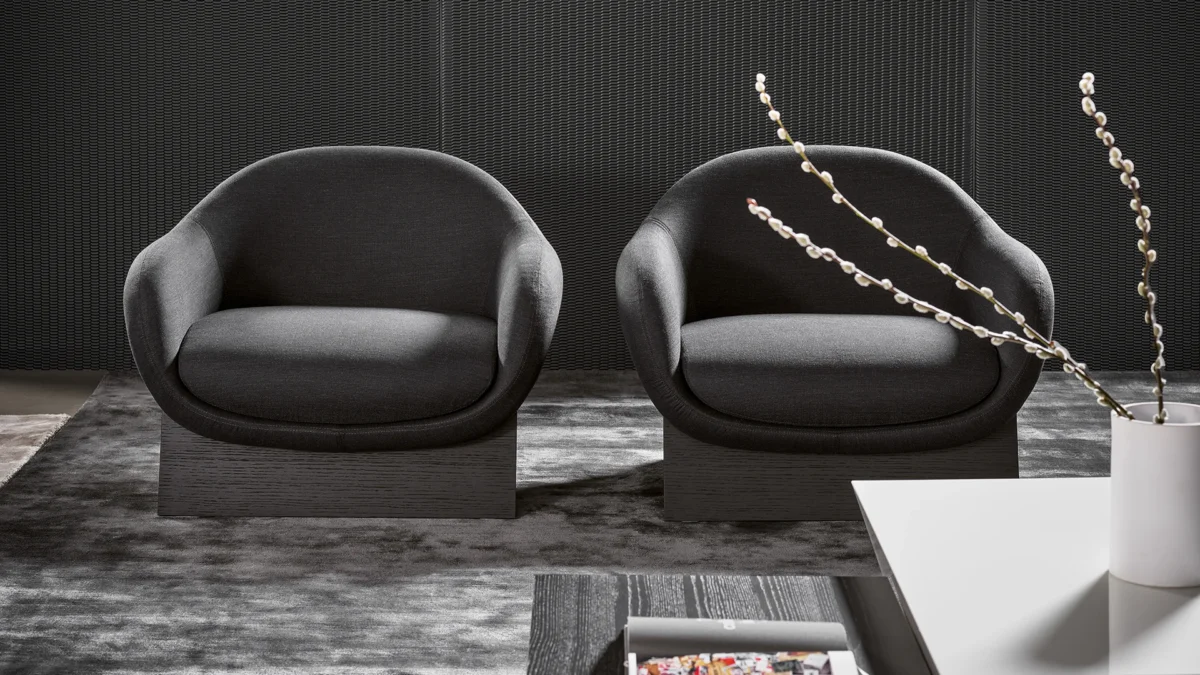 Bonaldo Boolean lounge chair with soft, curvilinear form and striking wood base—perfect standalone statement piece