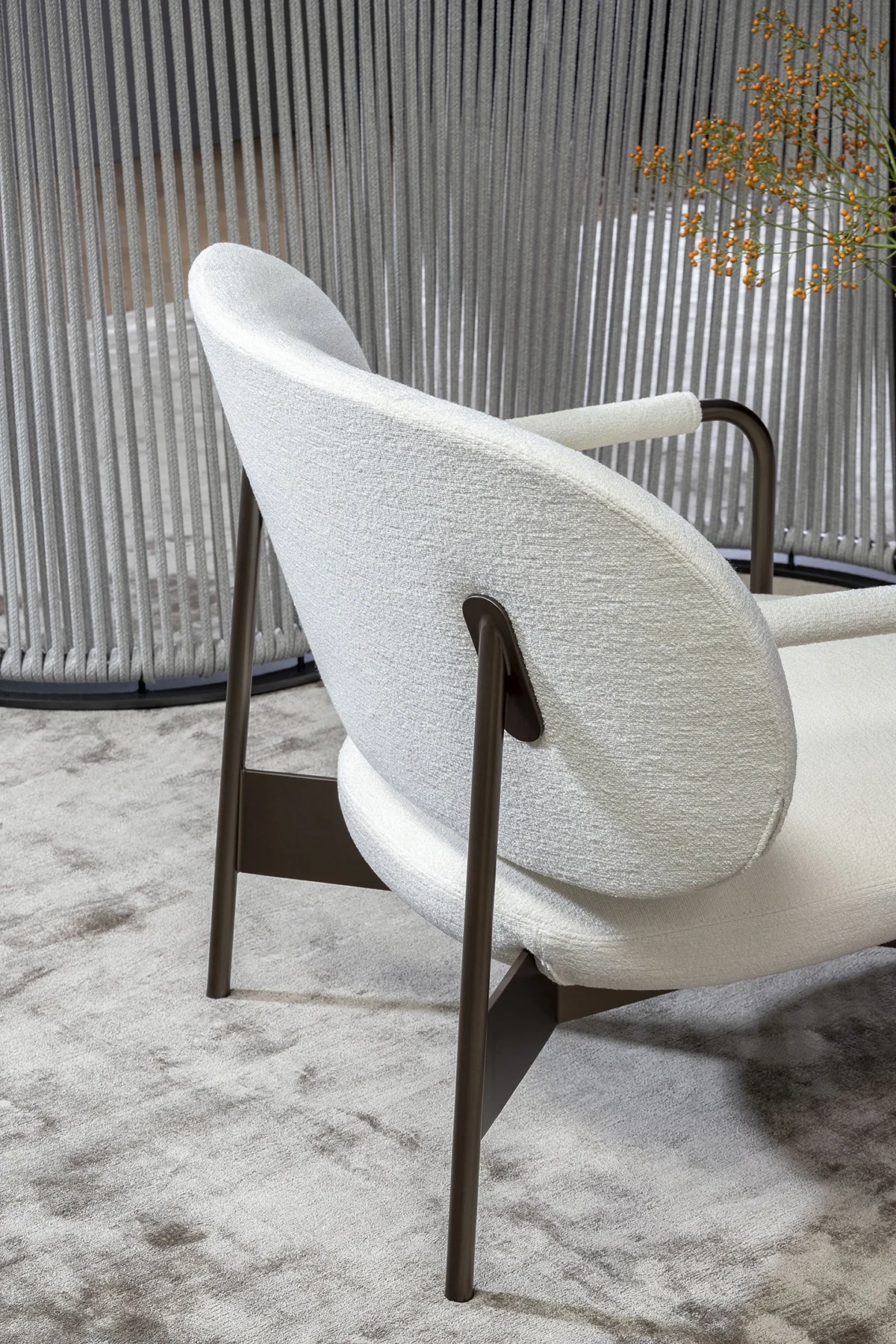 Bonaldo Cross Lounge armchair with oversized back and seat cushions supported by slender matte‑painted frame.