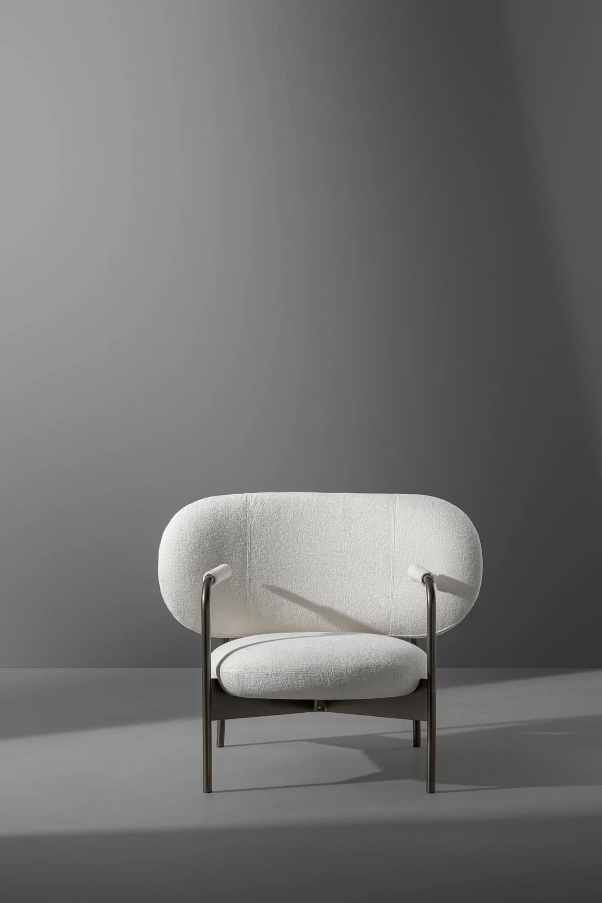 Bonaldo Cross Lounge armchair with oversized back and seat cushions supported by slender matte‑painted frame.