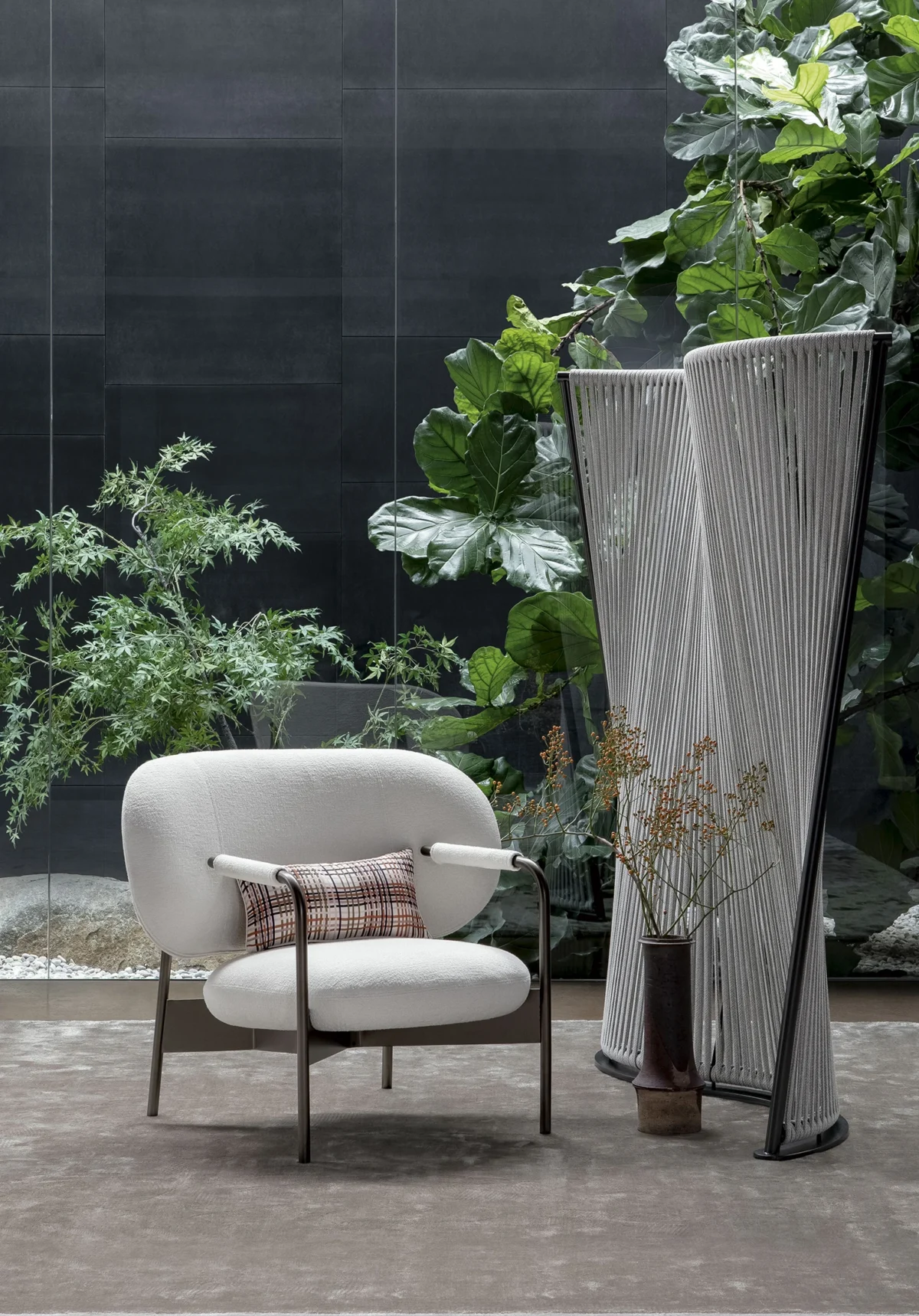 Cross Chair by Alain Gilles for Bonaldo: exposed cross‑shaped base as a visual signature, paired with plush padded forms.