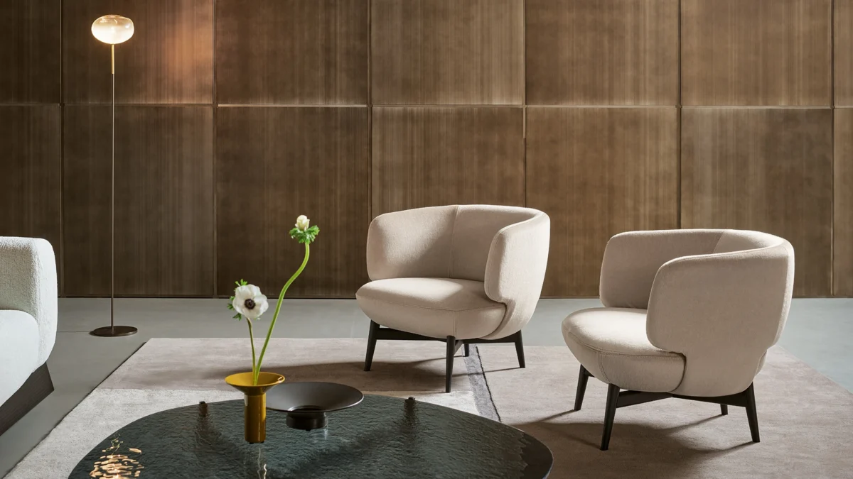 Bonaldo Doge armchair with compact enveloping form and 4‑star swivel base in anthracite metal finish