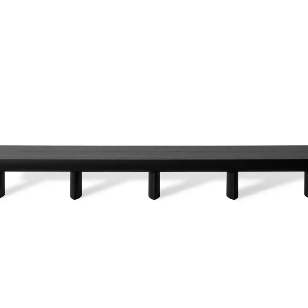 Bonaldo Sculptural console in canaletto walnut, featuring a gently arched top and five cylindrical legs for a low-profile media unit