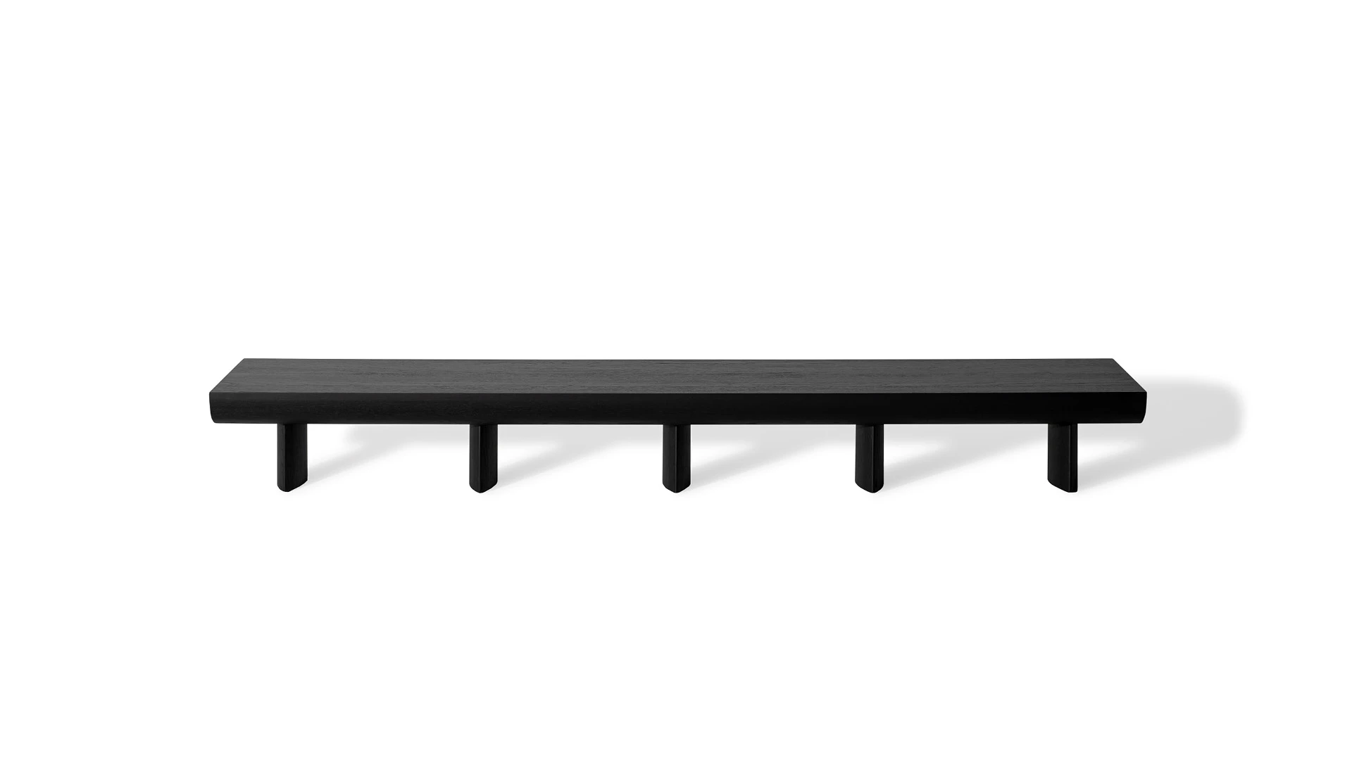 Bonaldo Sculptural console in canaletto walnut, featuring a gently arched top and five cylindrical legs for a low-profile media unit