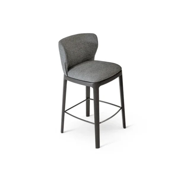 "Joy too chair in velvet with enveloping design and modern pedestal base."