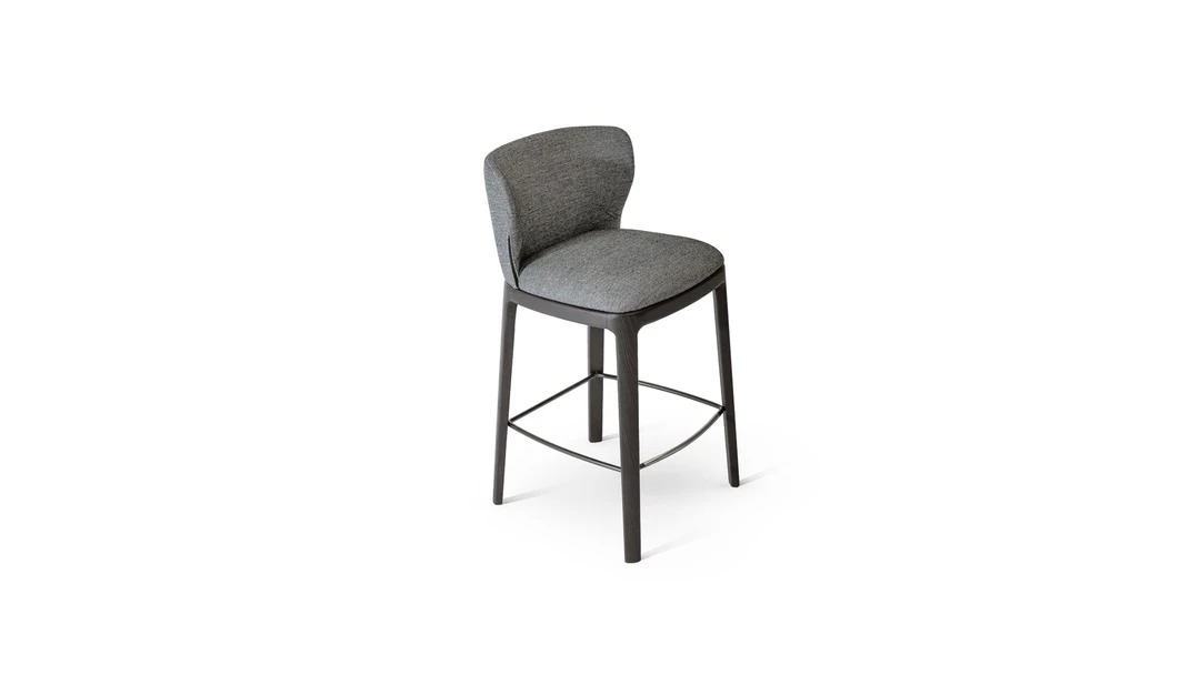 "Joy too chair in velvet with enveloping design and modern pedestal base."