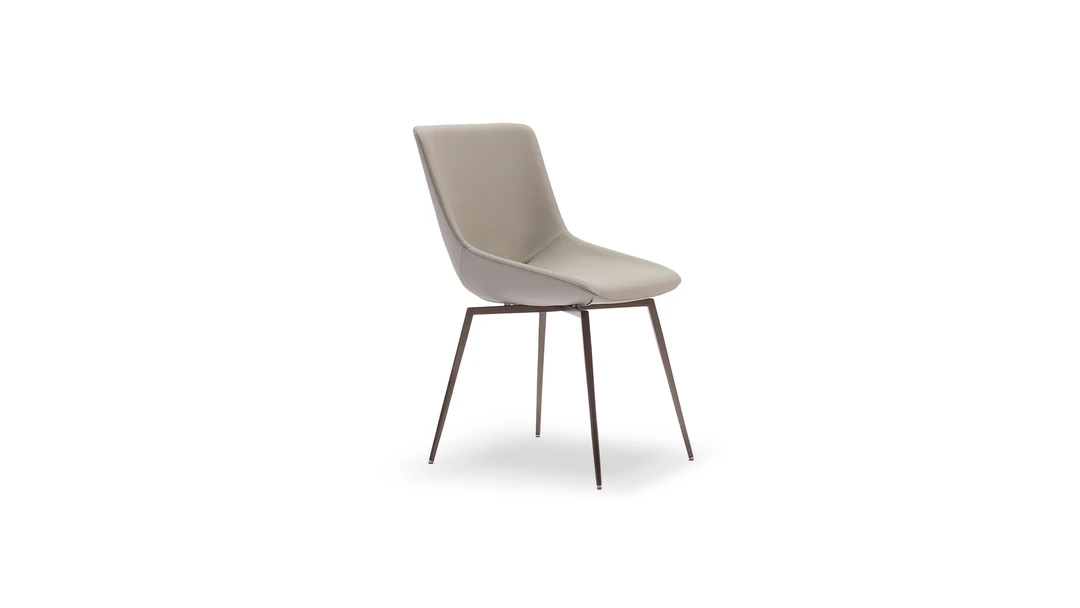 "Artika chair with sled base, upholstered in neutral fabric, suitable for both residential and contract use."