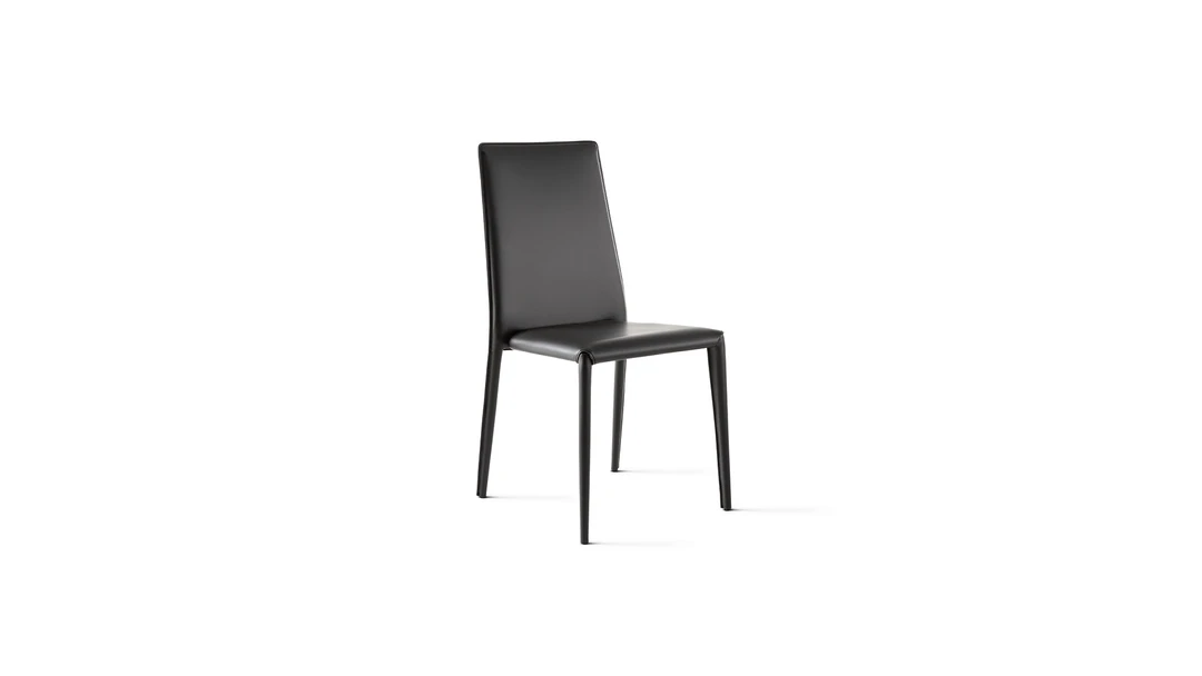 "Set of Eral chairs in muted tones around a minimalist dining table in a stylish interior."