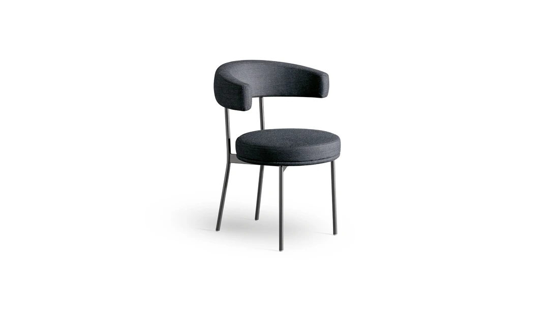 "Bonaldo Neuilly lounge chair with geometric lines, tubular metal frame, and plush padded seat."
