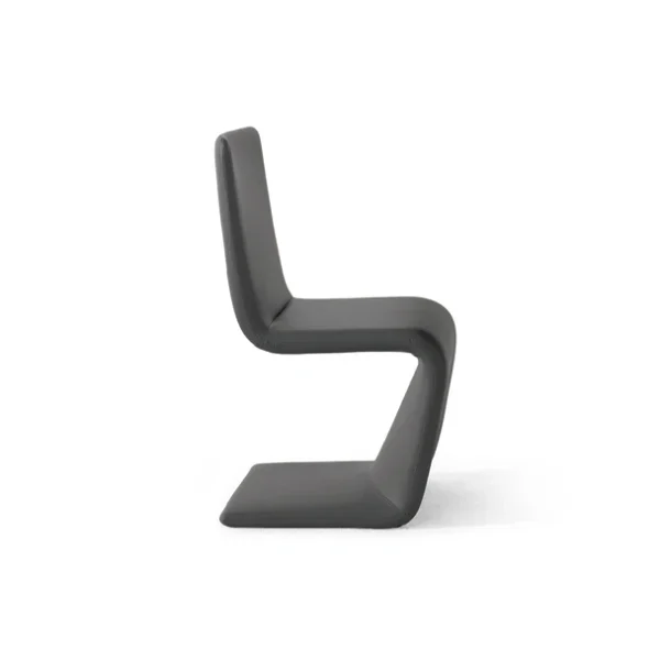 "Venus chair in deep green fabric with black legs, adding a bold accent to a contemporary space."