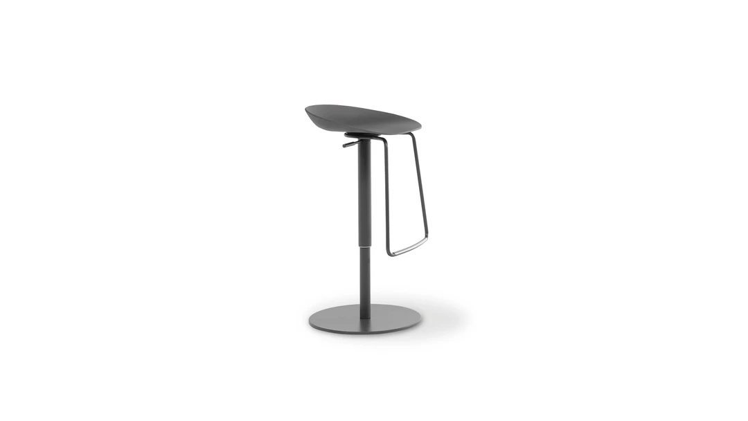 "Back view of Tab chair showcasing its soft curves and elegant simplicity."