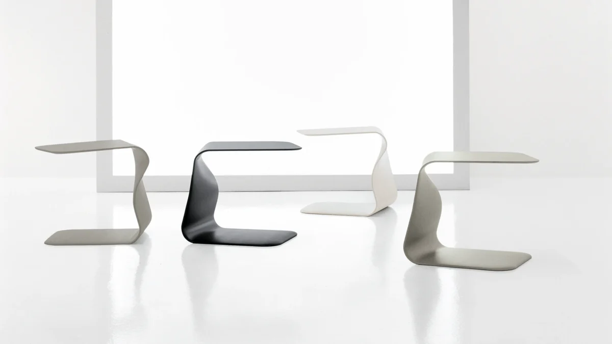 Bonaldo Duffy coffee table lacquered in bronze polyurethane, elegant form reflecting ribbon-like movement