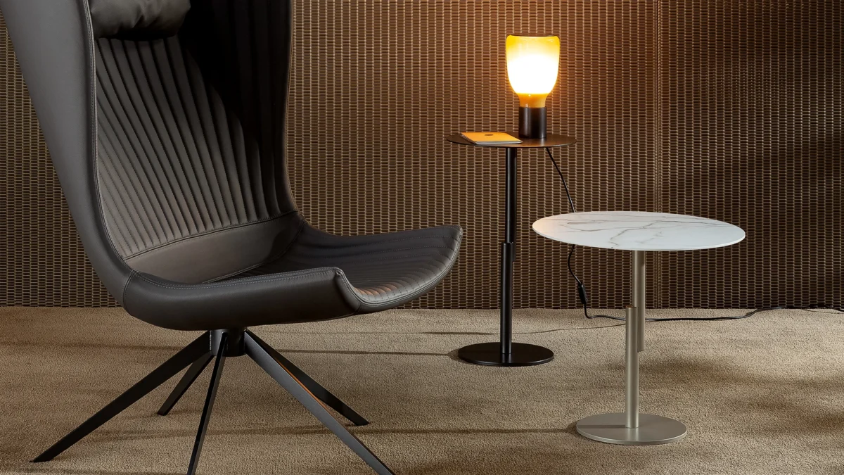 Grafts occasional table by Bonaldo with transparent glass surface and tapered stem-like metal legs