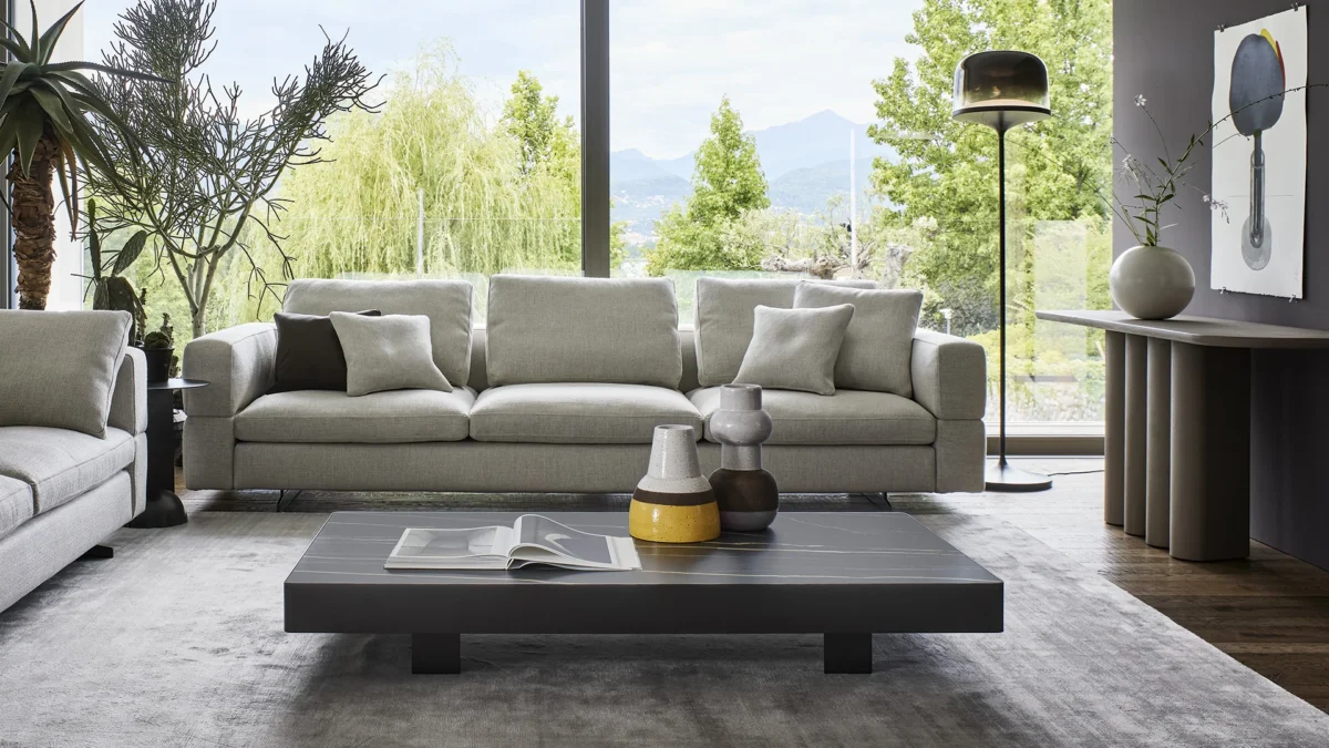 vModern Bonaldo Jazz low table with matte bronze metal band and round ceramic top, subtly elevated on discreet square feet