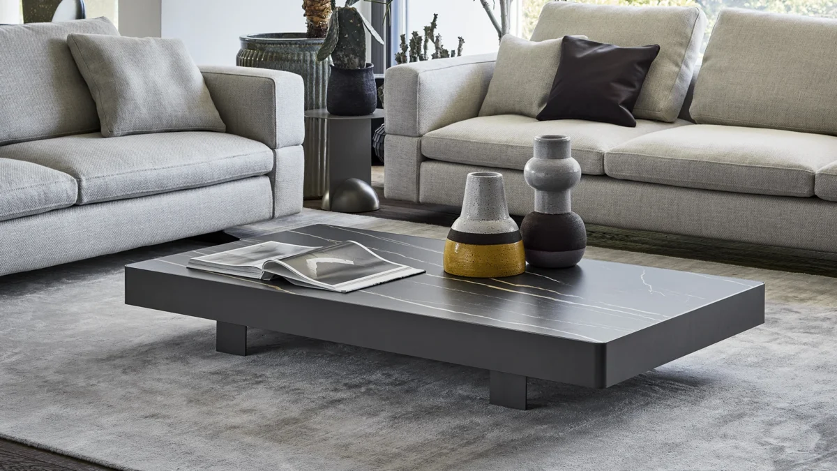 Jazz rectangular Bonaldo coffee table featuring expansive glass surface outlined by contrasting metallic trim with minimal floor footprint