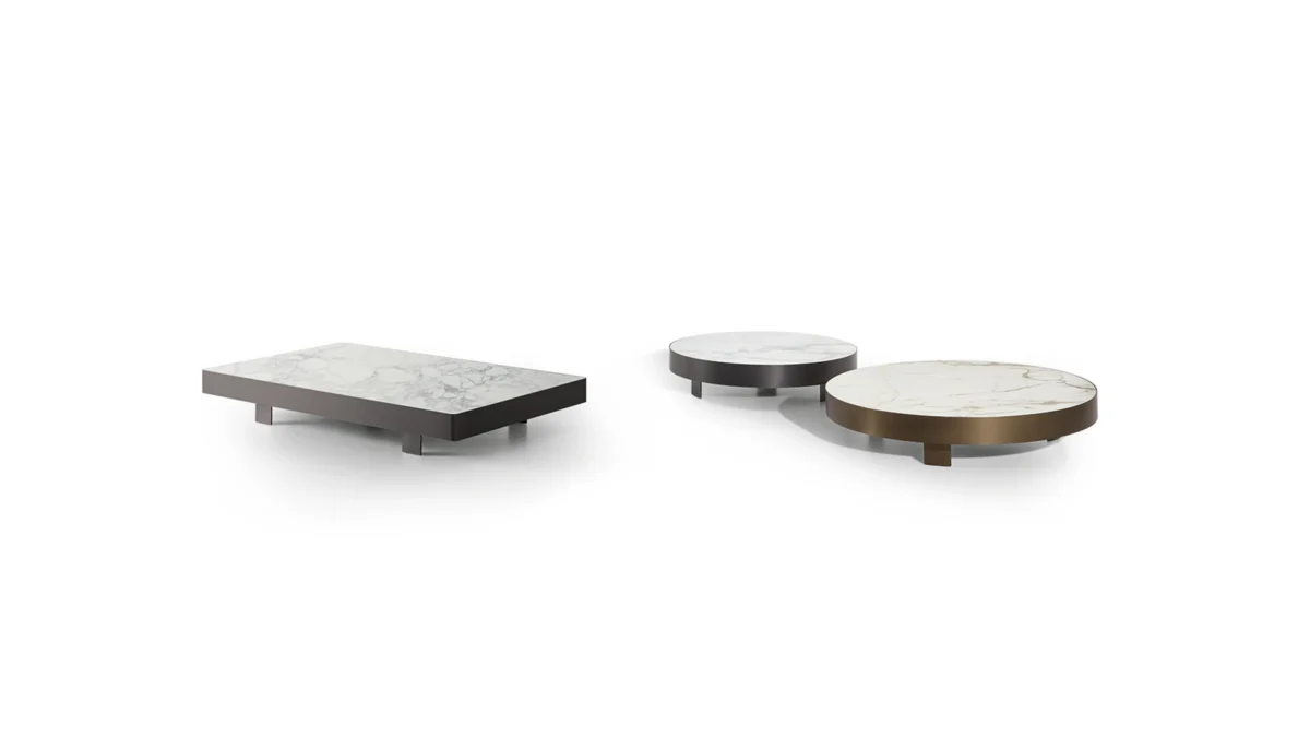 Bonaldo Jazz round coffee table with low-profile metal edge and floating ceramic top, supported on hidden geometric feet
